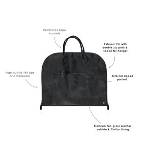 May include: Black leather garment bag with reinforced rope handles, a zippered pocket, and a double zipper with space for a hanger. The bag is made of premium full-grain leather with a cotton lining.