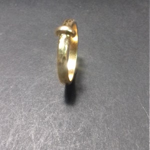 little faith inspired by outlander claire made of 9-carat hammered yellow gold