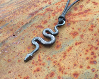 Snake pendant, hand forged from mild steel.
