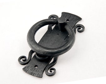 Door knocker, ornamental design. Hand forged from mild steel.