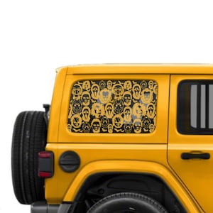 May include: A yellow Jeep with a rear window featuring a gold-colored decal of various horror movie villain faces. The decal is densely packed with iconic masks and characters, creating a spooky Halloween theme.