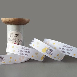 Neutraal "Welkom op de wereld kleintje" ooievaar met baby op wit lint, 15 mm breed *Verkocht per meter*