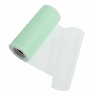 May include: A roll of light green tulle fabric, partially unrolled to reveal the white tulle underneath.