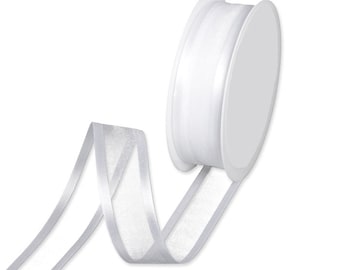 May include: A spool of white sheer ribbon with a silver shimmer. The ribbon is rolled up on a white plastic spool.
