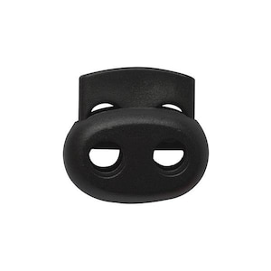 Puede incluir: Toggle de plástico negro con dos agujeros para asegurar cordones o correas.