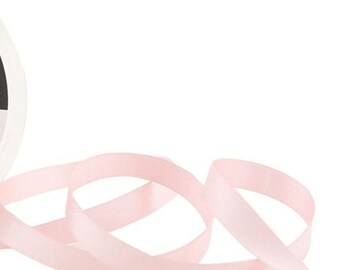 May include: A spool of pale pink satin ribbon. The ribbon is soft and smooth, and it is perfect for adding a touch of elegance to any project.