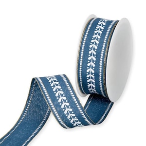 May include: A roll of blue ribbon featuring a white leaf pattern and gold edging. The ribbon is partially unrolled, showcasing the design. Suitable for crafts, gift wrapping, or general decorative use.
