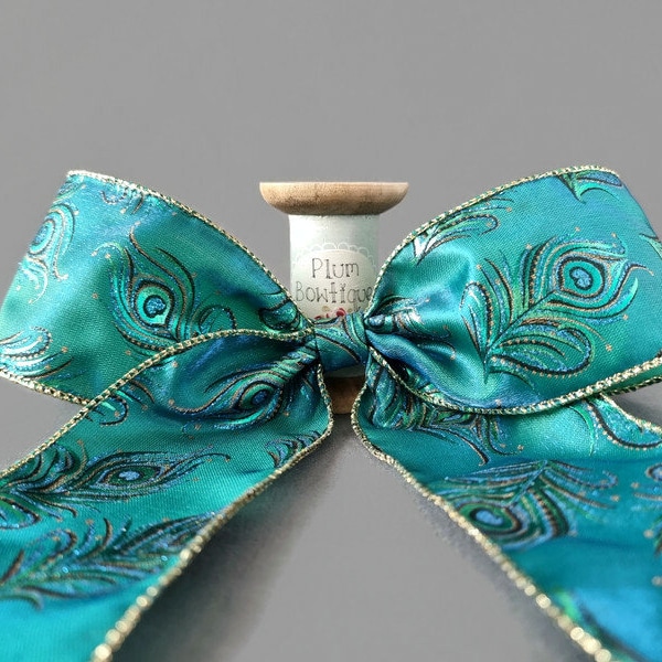 Filigree Peacock Feathers on Teal Shimmer Ribbon with Wired Edges, 63mm (2.5in) wide *Sold Per Metre*
