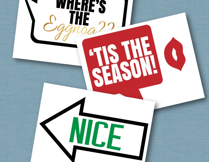 May include: Three white photo booth props with black outlines. The first prop is a speech bubble with the text "Where's the Eggnog?" The second prop is a red speech bubble with the text "'Tis the Season!" The third prop is a black arrow pointing to the left with the word "NICE" in green letters inside.