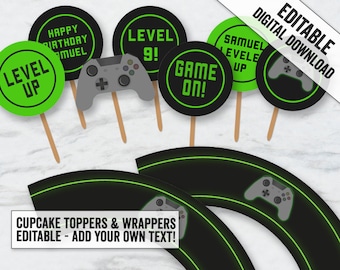 May include: Printable cupcake toppers and wrappers with a video game theme. The toppers feature a black and green design with the text "Level Up", "Game On!" and "Level 9!" The wrappers feature a black and green design with a video game controller.