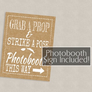 May include: A brown burlap sign with white text that reads "Grab a prop & strike a pose Photobooth this way" with a white arrow pointing to the right. The sign also includes a white mustache and lips graphic. The text "Photobooth Sign Included!" is in a gray box on the sign.