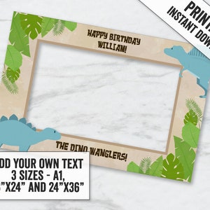 May include: Printable photo booth frame with a dinosaur theme. It features a blue dinosaur on the bottom and a green dinosaur on the top. The frame has a brown background with green leaves. The text "Happy Birthday William!" and "The Dino Wranglers!" is included. The frame is available in three sizes: A1, 18"x24" and 24"x36".