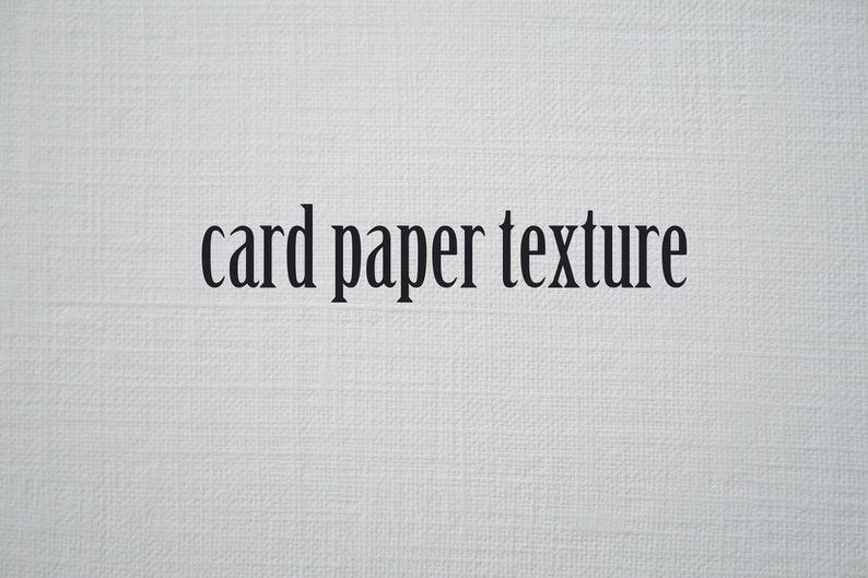 May include: Close-up of a white card paper texture. The text "card paper texture" is printed in black.