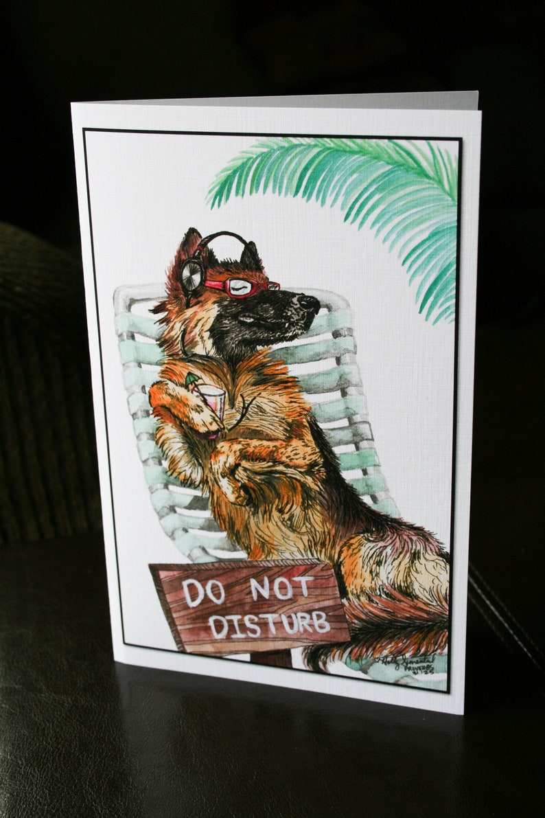 May include: A watercolor illustration of a German Shepherd dog wearing headphones and sunglasses, relaxing on a lounge chair with a drink in its paw. A sign reads "Do Not Disturb".