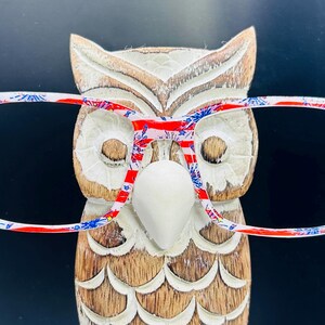 Adorno magnético para gafas con fuegos artificiales en rojo, blanco y azul
