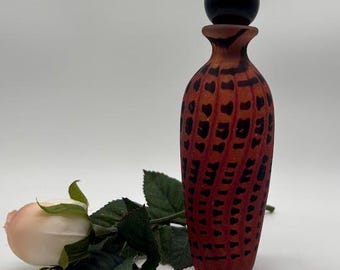 Hand blown, art glass perfume bottle in zipper pattern. 7&quot;