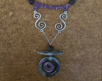 Amethyst and black bead necklace with tribal pendant