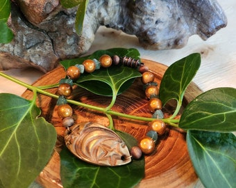 Charming Shades of copper in this Raku pottery & beaded bracelet