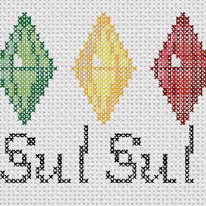 May include: Cross-stitch pattern featuring three colourful diamonds in green, yellow, and red, with the word "Sul Sul" stitched below.
