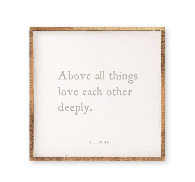 May include: A square wall sign with a natural wood frame and a white center panel. The text in gray reads: Above all things love each other deeply. 1 PETER 4:8. The design features a clean, simple layout with centered lettering on a flat surface.