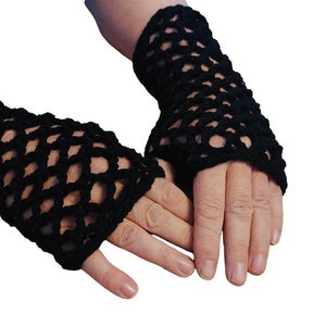 May include: A pair of black fingerless gloves made of crocheted mesh. The gloves are worn on a person's hands.