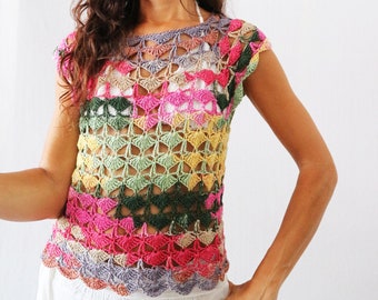 May include: A multi-colored crochet top with a scalloped hem. The top is made with a variety of colors, including pink, green, yellow, and purple.