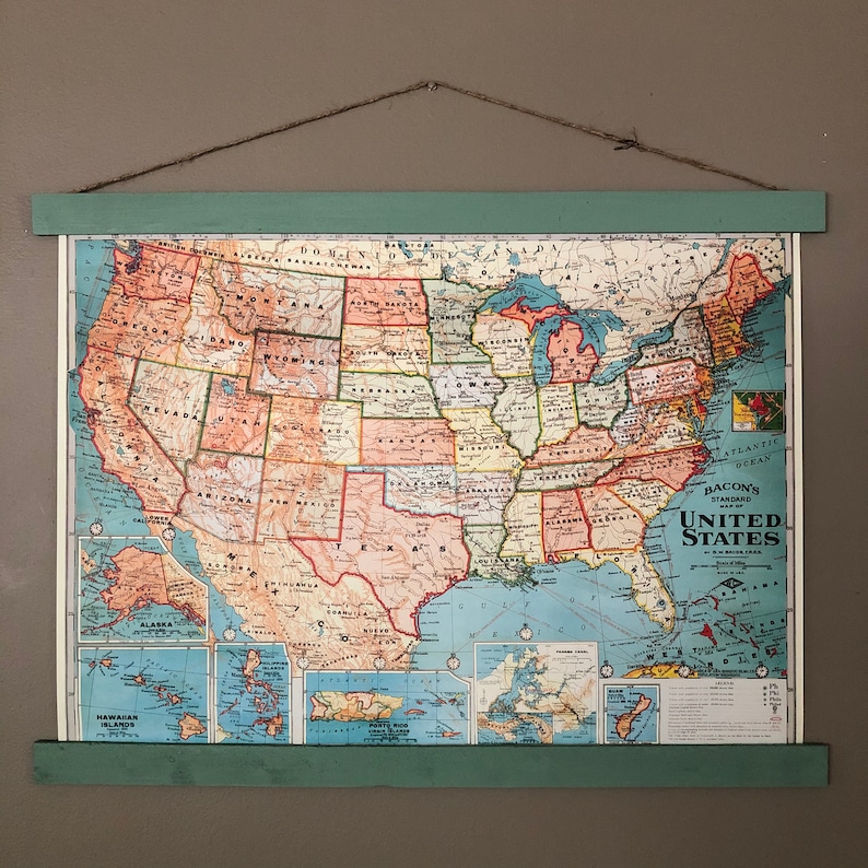 May include: A vintage map of the United States with state borders and names labelled in a colourful, stylised font. The map includes Alaska and Hawaii, and the text "Bacon's Standard Map of the United States" is printed in the lower right corner.