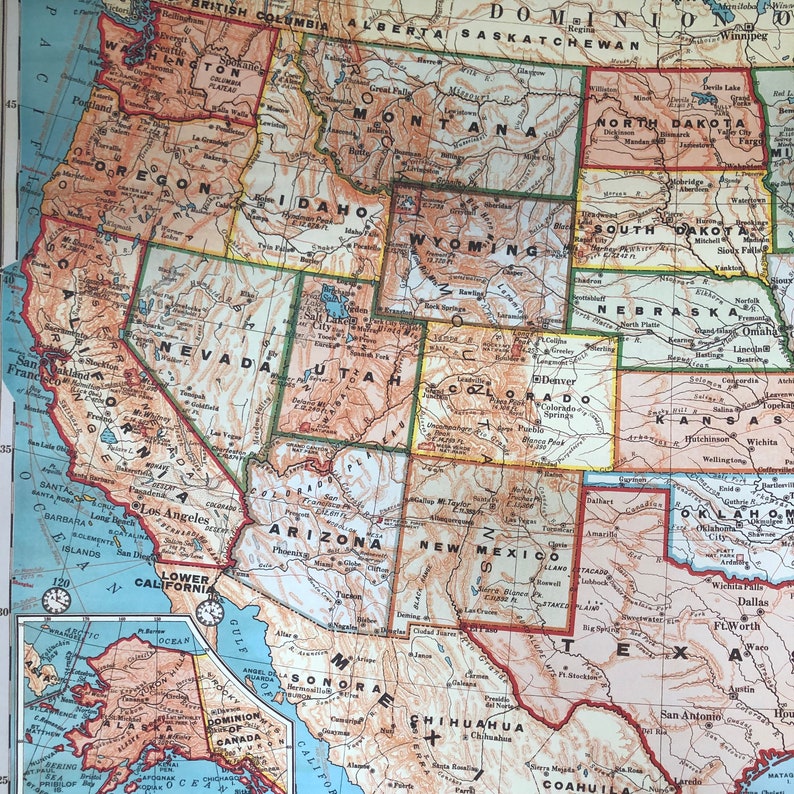 May include: A vintage map of the United States, showing state borders and major cities. The map is in shades of brown, green, and yellow, with a blue border around the country. The map includes the states of Washington, Oregon, California, Nevada, Utah, Arizona, New Mexico, Colorado, Wyoming, Montana, Idaho, North Dakota, South Dakota, Nebraska, Kansas, Oklahoma, Texas, and more.