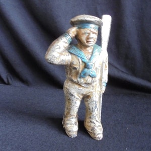 cast iron vintage sailor piggy bank/colecting piggy bank