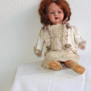 antique doll complete / french doll with antique clothing and lace / antique rattle / doll with movable hands and legs as  sleeping eyes