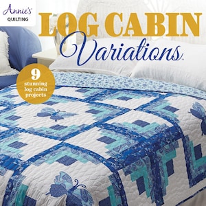 Puede incluir: Un edredón azul y blanco con un diseño de cabaña de troncos, con aplicaciones de mariposas. El edredón está sobre una cama con almohadas blancas y una colcha con estampado floral. El texto "LOG CABIN Variations" y "Annie's Quilting" son visibles.