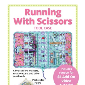 May include: A colorful tool case with the text "Running With Scissors" is displayed. The case is open, revealing pockets and compartments for scissors, markers, and other small tools. The design includes floral and geometric patterns in pink, teal, and purple.