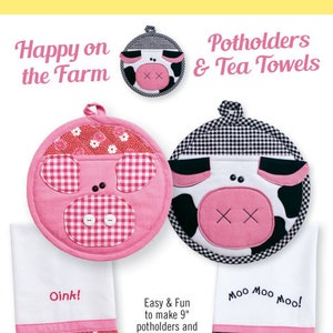 May include: Pink and black cow-themed potholders and tea towels. The potholders are round with gingham and floral accents. The tea towels have cow legs and the phrases "Oink!" and "Moo Moo Moo!" printed on them.