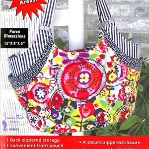 May include: The Quattro purse pattern with a vibrant floral design. The bag has black and white striped straps and trim. The dimensions are 30.5cm x 23cm x 12.7cm. It features four exterior storage areas, a back zippered storage, and a convenient front pouch.