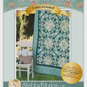 May include: A quilt pattern titled Fresh Cut Roses featuring a geometric block design in shades of teal, green, and white with floral fabric accents. The pattern includes 5 sizes and mentions 2 inch Star Singles. The Shabby Fabrics logo is visible.