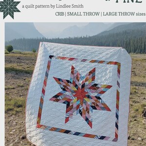 May include: A quilt pattern titled Patchwork Lone Star by Lindlee Smith for Plains & Pine. The quilt features a central multi-colored star made of various fabric scraps, surrounded by a white border with a quilted clamshell pattern.