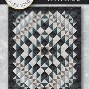 May include: A quilt pattern titled Grand Entrance by Needle in a Hayestack featuring a geometric design of triangles in shades of black, white, and gray. The pattern includes the text PTN3040 and dimensions of 76 inches by 93 inches by Northcott.