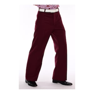 May include: A pair of wide-legged pants in a deep burgundy color. The pants have a straight leg and a slightly flared hem. They are made of a smooth, wrinkle-resistant fabric.