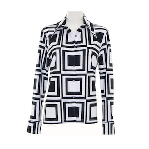 May include: A black and white geometric patterned long-sleeve shirt with a button-up collar.
