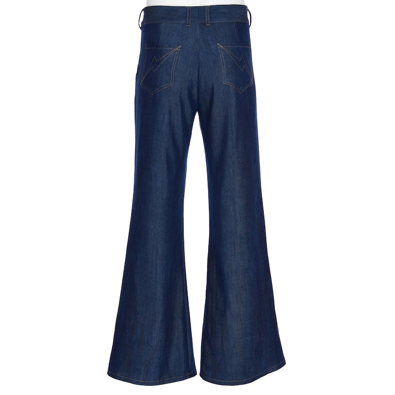 May include: Dark blue denim bell-bottom pants. The pants have a high waist and feature two back pockets with decorative stitching. The flared legs create a retro silhouette. The pants are made of a sturdy denim material.