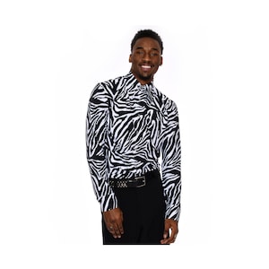 May include: A long-sleeved button-up shirt with a black and white zebra print.