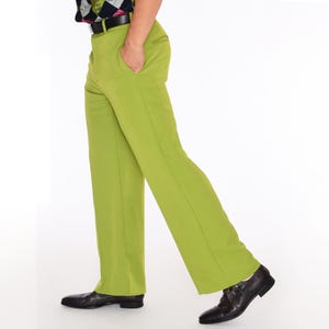 May include: A pair of lime green pants with a wide leg silhouette. The pants have a belt loop waistband and a zipper fly.
