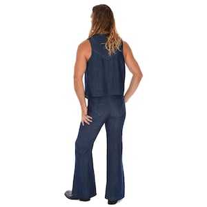 May include: A denim vest and flared pants set in a medium blue wash. The vest is sleeveless and cropped, and the pants have a high waist and wide legs. The outfit is a retro style, reminiscent of the 1970s.