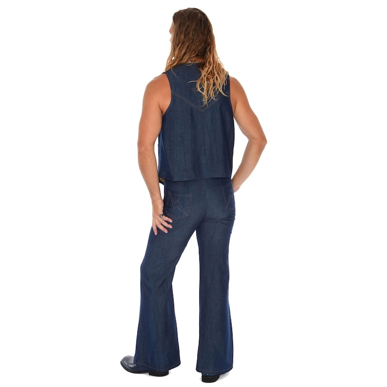 May include: A denim vest and flared pants set in a medium blue wash. The vest is sleeveless and cropped, and the pants have a high waist and wide legs. The outfit is a retro style, reminiscent of the 1970s.