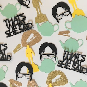 May include: Black and green confetti with the phrase "That's What She Said" and images of a teapot, a man with glasses, and a gold glitter lip.