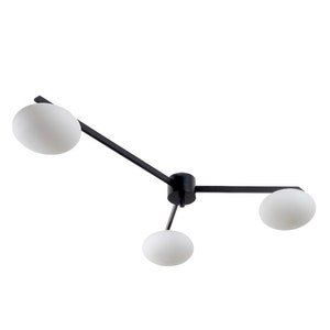 May include: Black ceiling light fixture with three white globe-shaped shades.