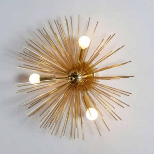 Brass starburst wall sale sconce