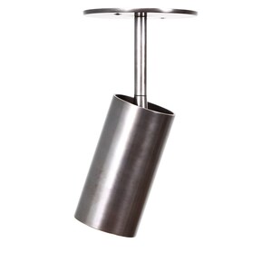 May include: A silver metal ceiling light fixture with a cylindrical shade that is angled downwards. The light fixture has a round base with a small hole in the center.