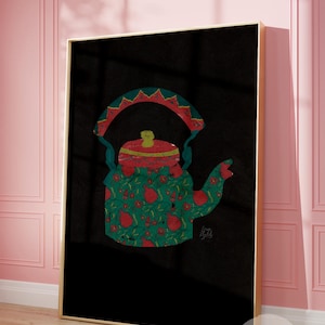 May include: A framed art print featuring a colorful illustration of a teapot. The teapot is decorated with a green and red floral pattern, with a black background. The print is in a gold frame and is displayed against a pink wall.