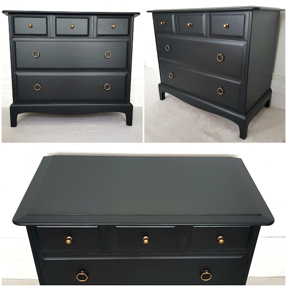 A Pair of Stag Minstrel Painted Black Chests of 5 Drawers